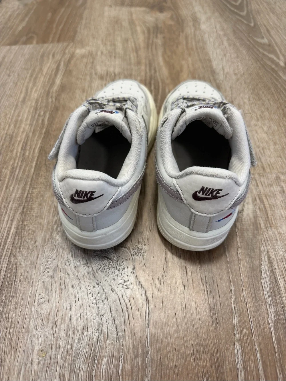 Nike Kids White and Light Gray Low-Top Sneakers with Purple Logo
